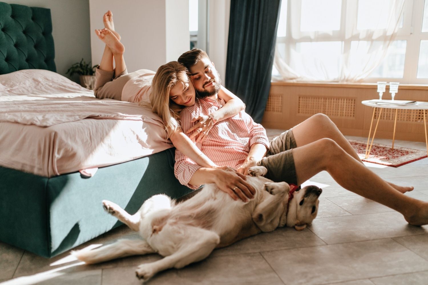 Family relaxing at home with their dog