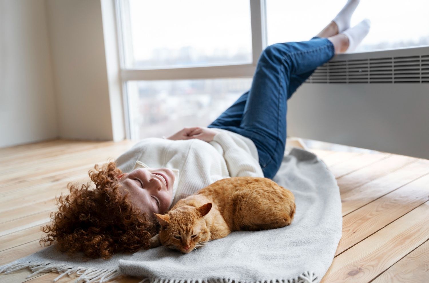 Homeowner relaxing at home with a cat