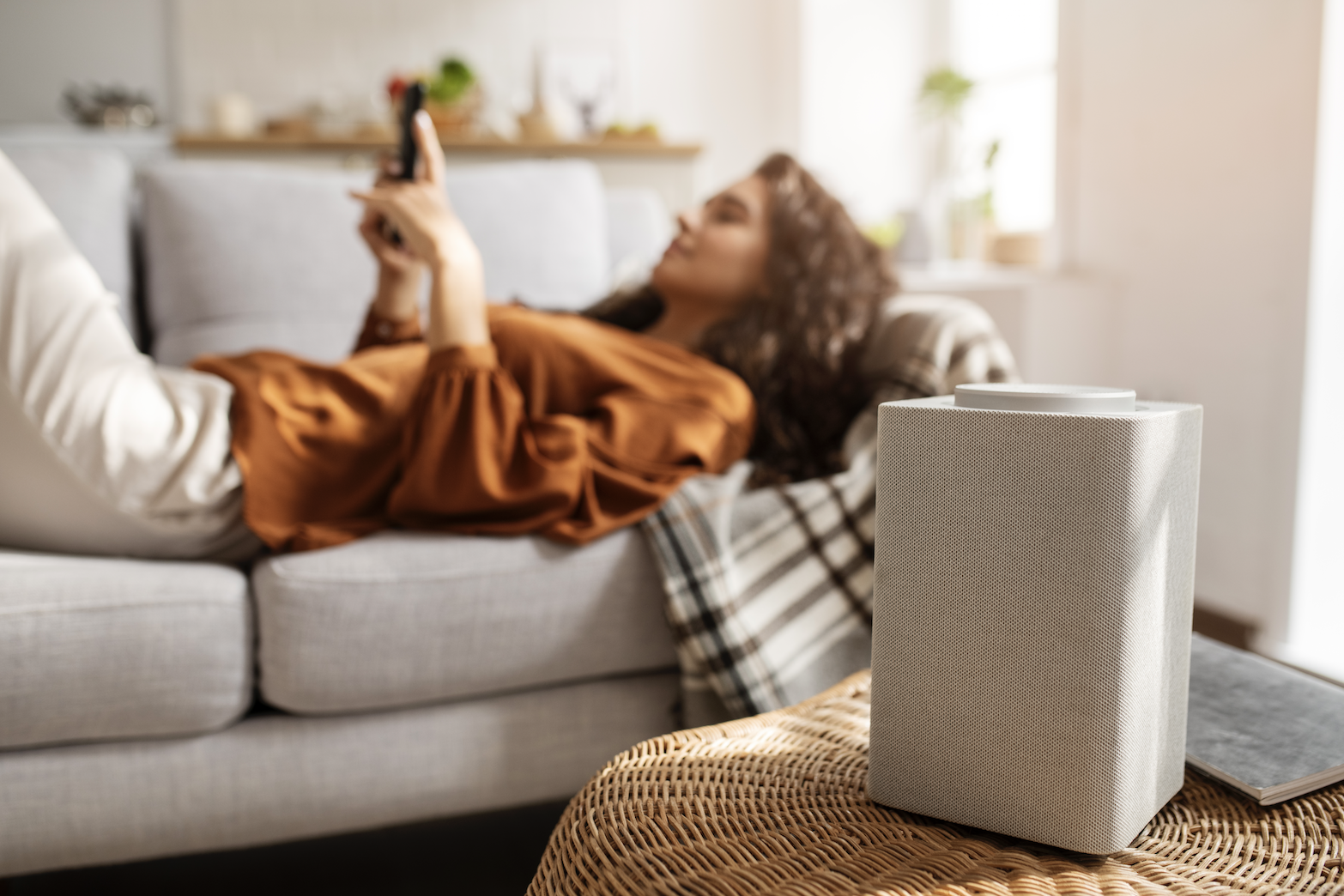 Homeowner relaxing at home with an air purifier
